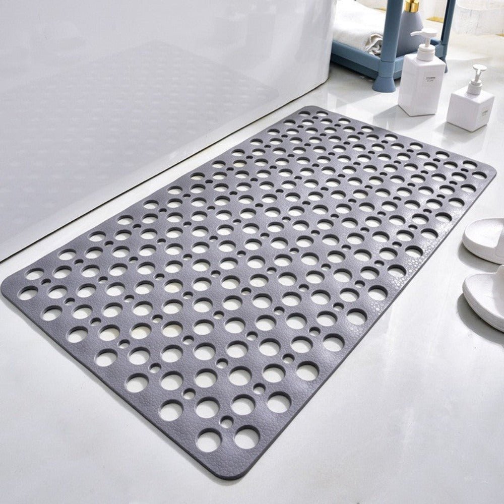 Non-slip shower mat featuring strong suction cups for stability, quick drainage holes for efficient water flow, and mold-resistant material for a hygienic bathroom experience. 0